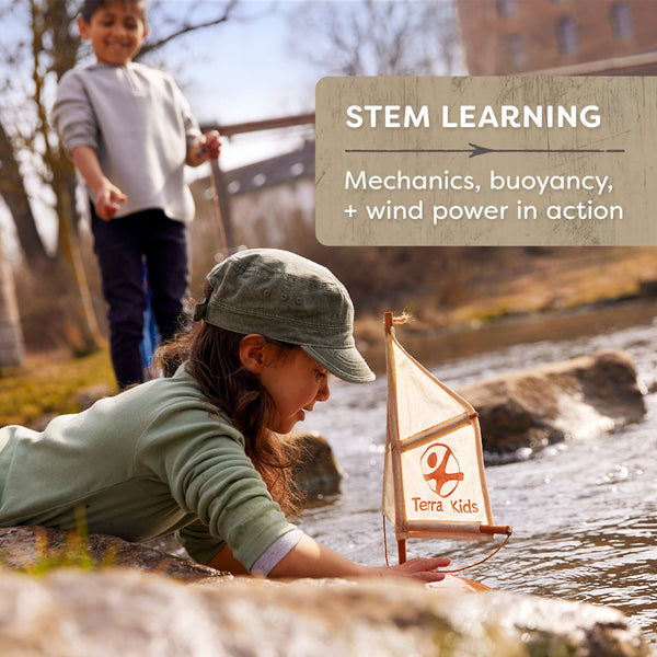 Child playing with a sailboat by a stream, with 'Terra Kids' branding. Discover the Terra Kids Catamaran DIY Activity Kit at Clozist. An eco-friendly STEM gift for kids 8+ featuring natural cork, beechwood, and linen sails. Build it, float it, and explore the science of sailing. The perfect sustainable Amazon alternative for green shopping!