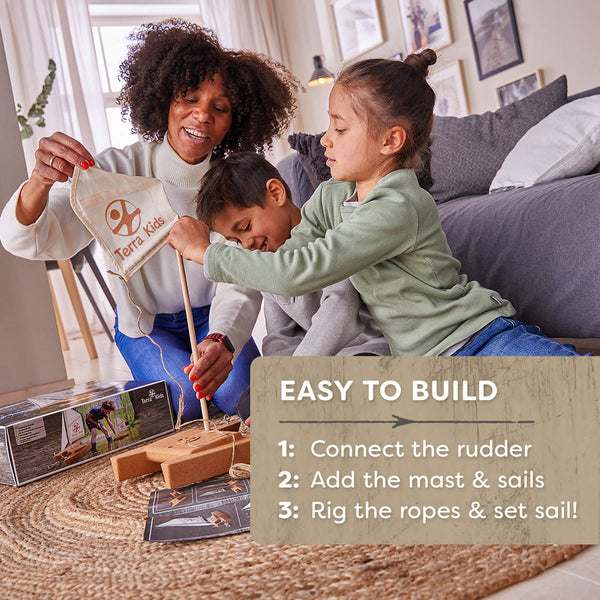 Woman and two children playing with a toy sailboat in a living room.