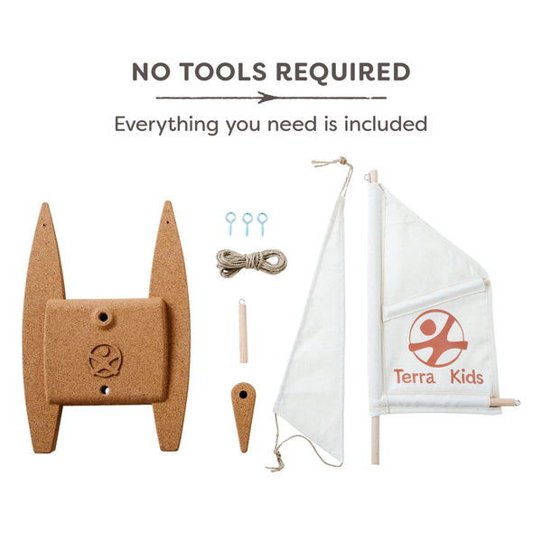Children's sailboat kit with cork base and white sail featuring Terra Kids logo on a white background.