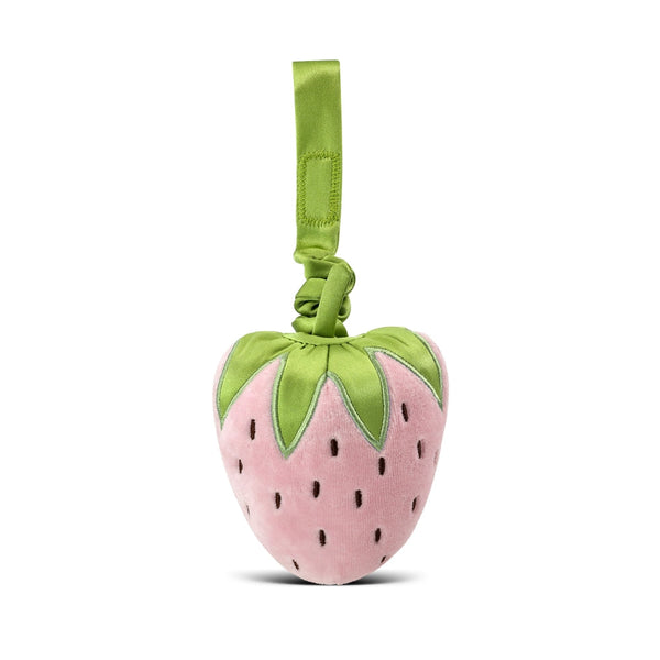 Pink strawberry-shaped toy with green leaves on a white background