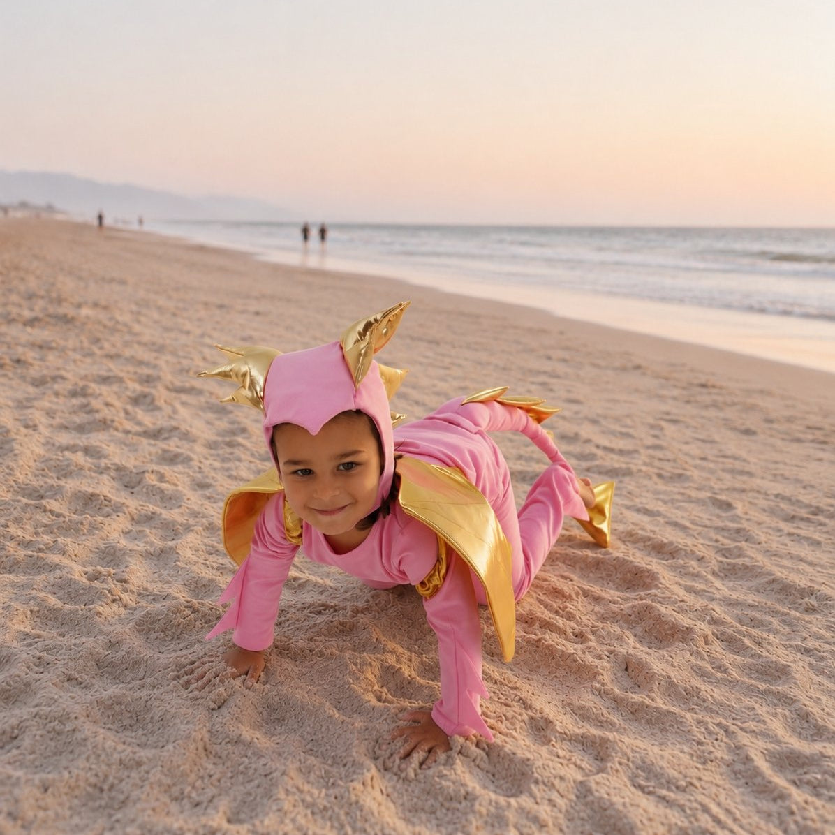 Toddler in the Pink Sky Dragon costume with golden dragon wings