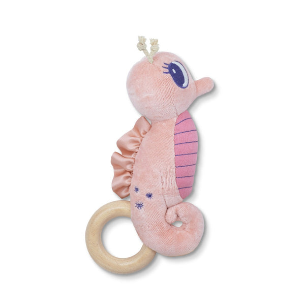 Pink plush seahorse toy with a wooden ring on a white background