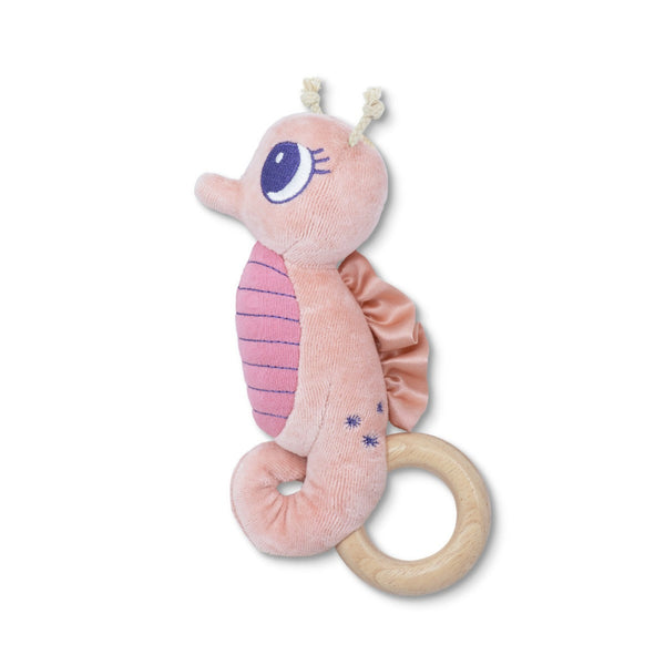 Pink plush seahorse toy with a wooden ring on a white background
