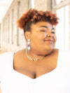 Fair Anita Wildflower Field teal statement earrings styled on model showing drop length
