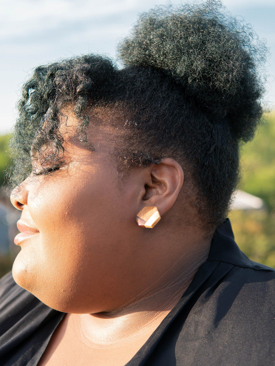 Fair Anita wooden hexagon stud earrings styled as an everyday accessory
