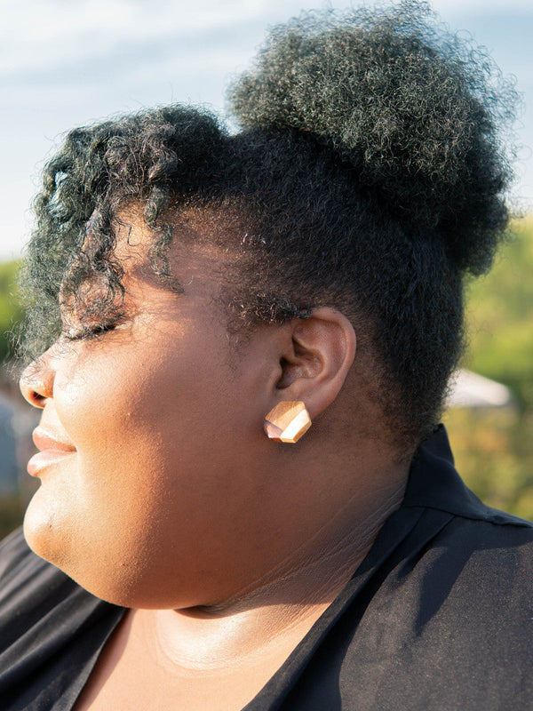 Fair Anita wooden hexagon stud earrings styled as an everyday accessory