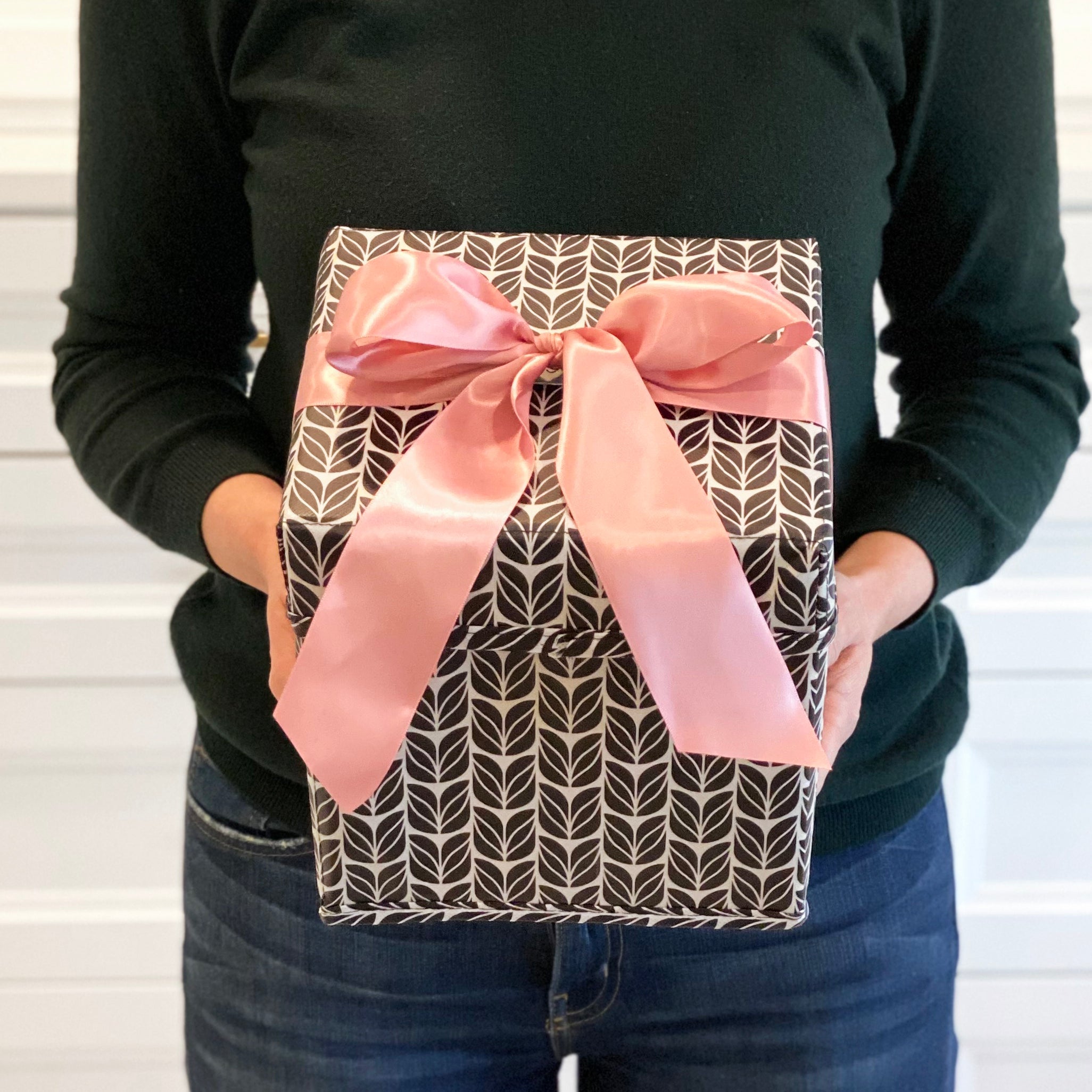 EverBox folded flat for storage — compact collapsible gift box in black, white and pink
