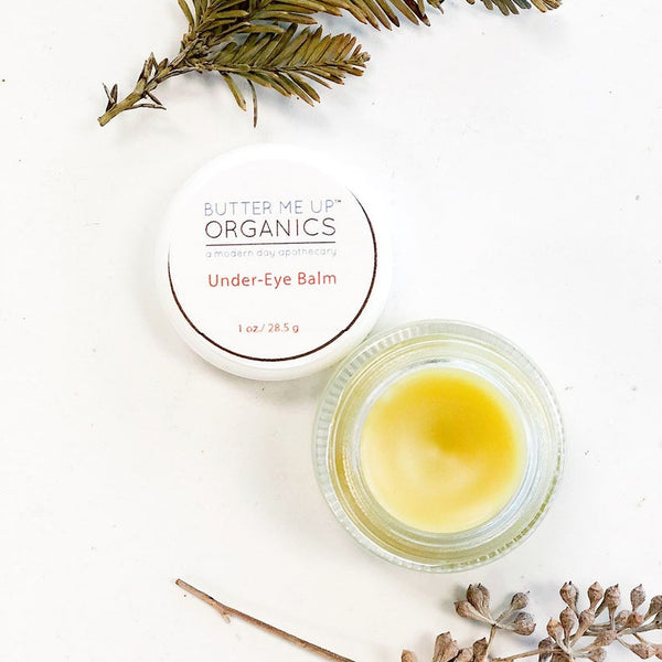 Butter Me Up Organics caffeinated under eye balm in glass jar for dark circles and puffiness