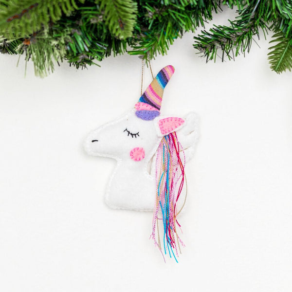 Add a touch of magic to your holiday decor with our adorable Felt Unicorn Ornament. Made from sustainable materials and featuring vibrant colors, this ornament is the perfect addition to any Christmas tree. Order yours today!