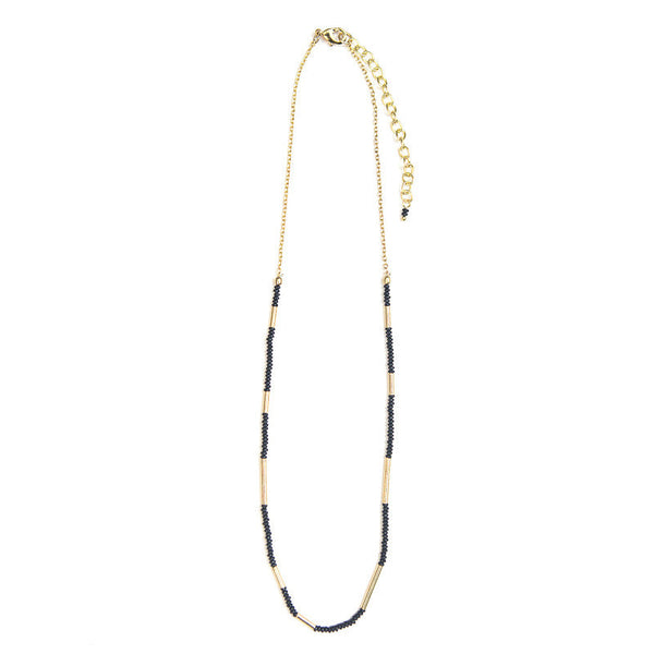 Fair trade Morse Code Necklace with natural black beads and brass accents worn as a layering necklace