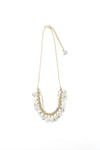 Fair trade speckled bone necklace worn as a styled accessory, made by women artisans in India