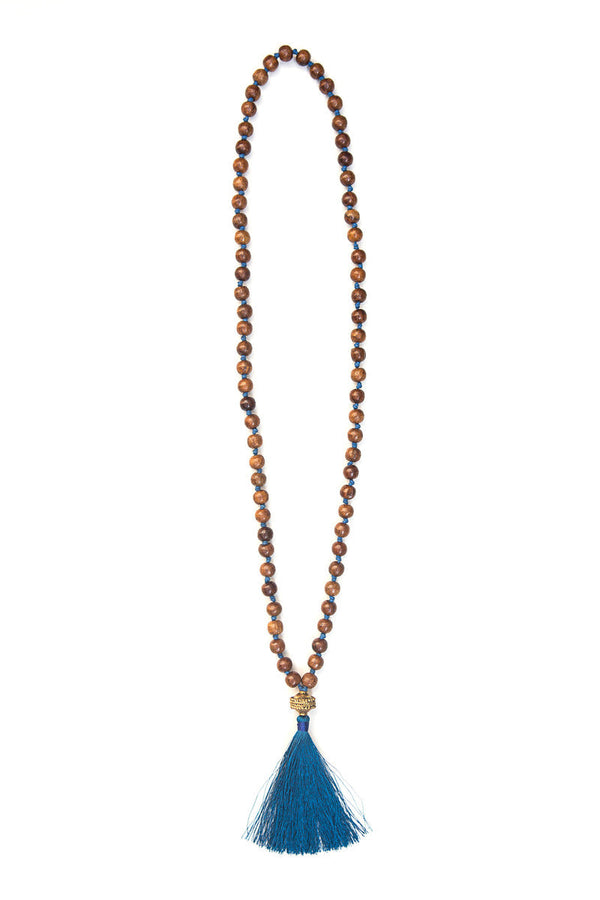 Wooden Warrior Tassel Necklace styled outfit flat lay – nickel-free fair trade beaded necklace