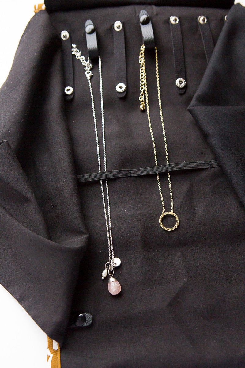 Close-up of necklace loops and elastic tuck layer inside the Fair Anita Wayfarer Jewelry Roll