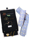Wayfarer jewelry roll travel organizer in diamond pattern, unrolled to show earring and ring storage — Fair Anita