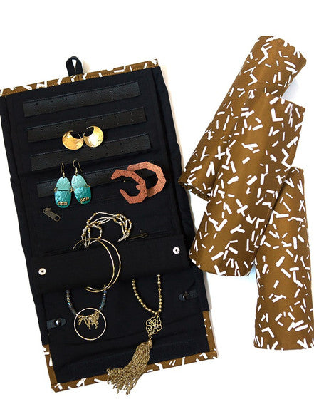 Close-up of hand screen-printed Confetti Mustard pattern on the Wayfarer Jewelry Roll organic cotton fabric