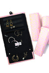 Close-up of handwoven organic cotton jewelry roll with zipped pouches and necklace loops — Fair Anita
