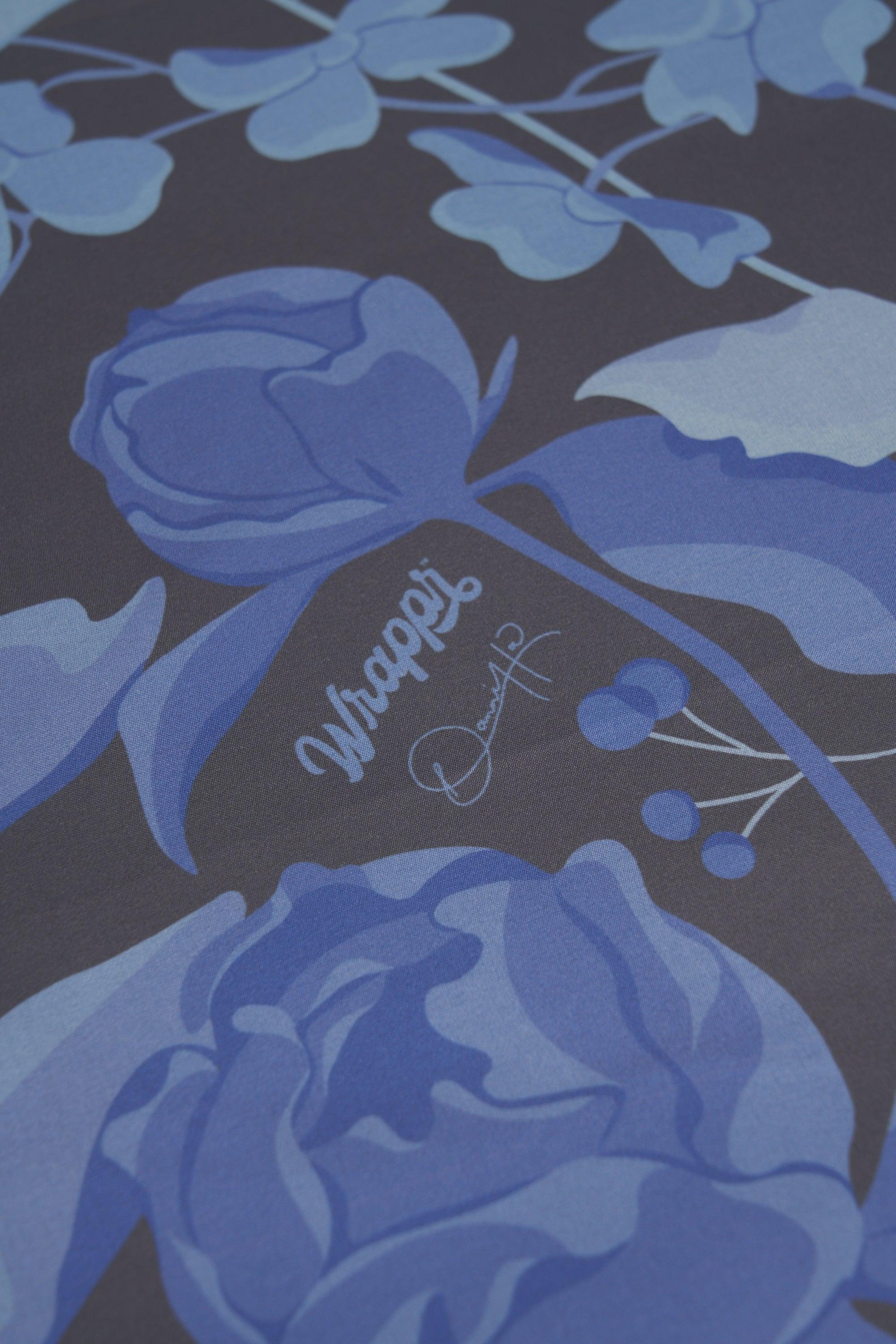 Blue floral design with 'Whaple' branding on a dark background