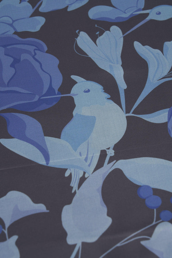 Blue bird and floral pattern on a dark background