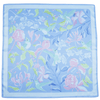 Floral and hummingbird patterned fabric square on a light blue background