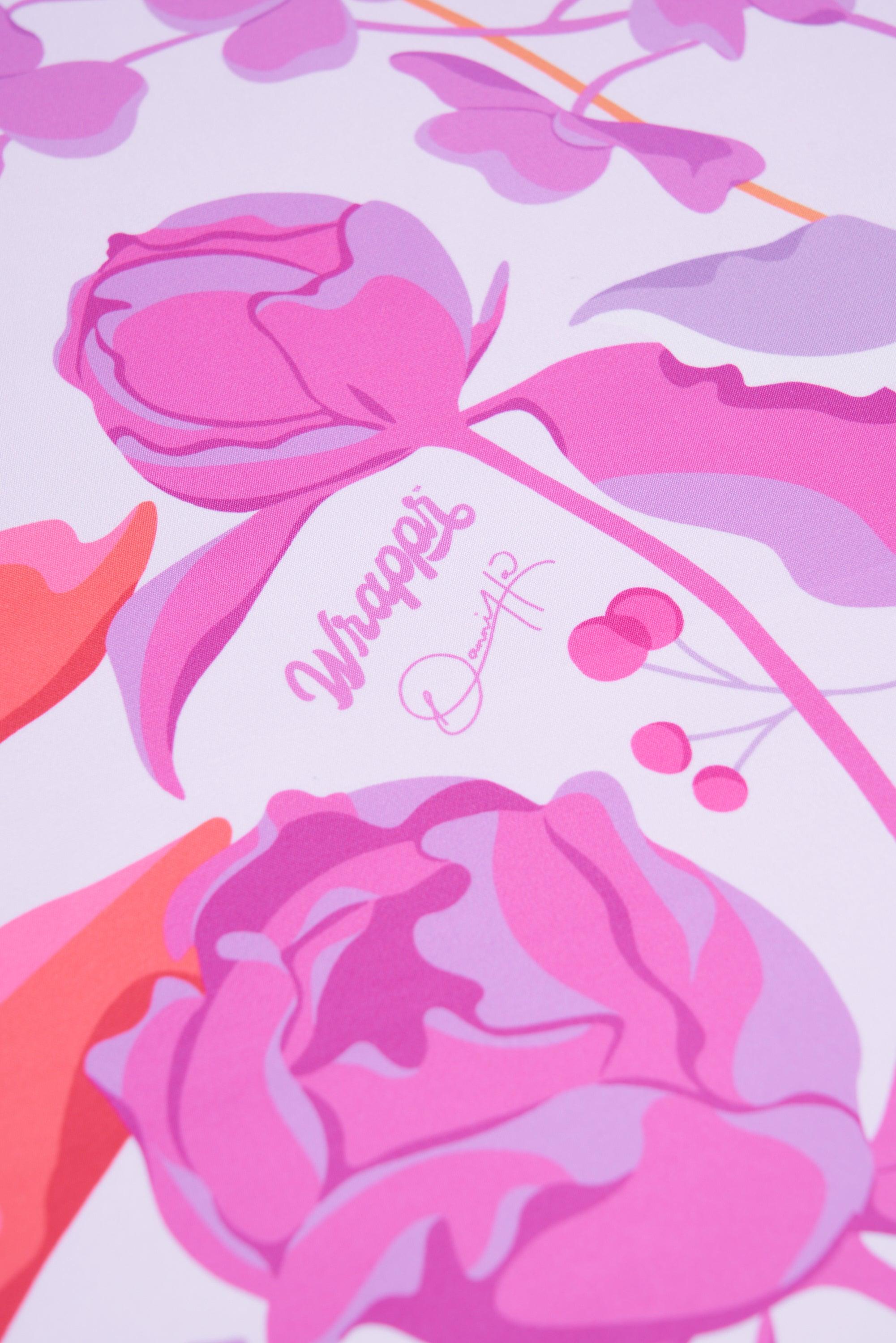 Decorative design with pink flowers and the word 'Wrappers' on a light purple background