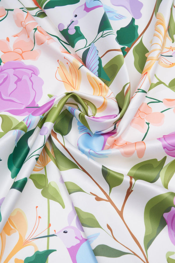 Floral fabric with colorful flowers and leaves on a white background