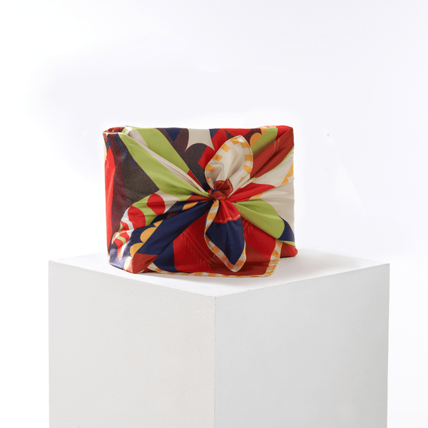 Vision furoshiki wrap styled as reusable gift wrapping around a shoe-box-sized present