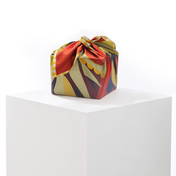 Colorful folded fabric package on a white background