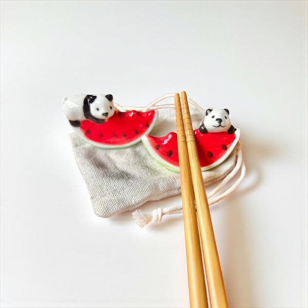 Panda & Watermelon Chopstick Rest set of 2 on a table