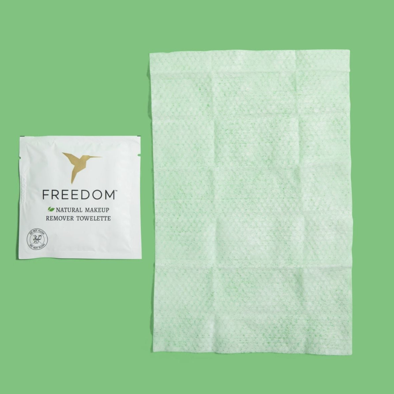 Close-up of Freedom Natural makeup remover wipe being used to gently cleanse skin