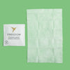 Close-up of Freedom Natural makeup remover wipe being used to gently cleanse skin