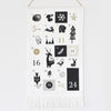 Advent calendar with black and white illustrations on a white background