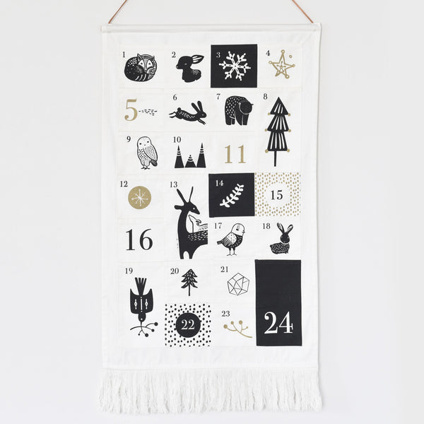 Advent calendar with black and white illustrations on a white background