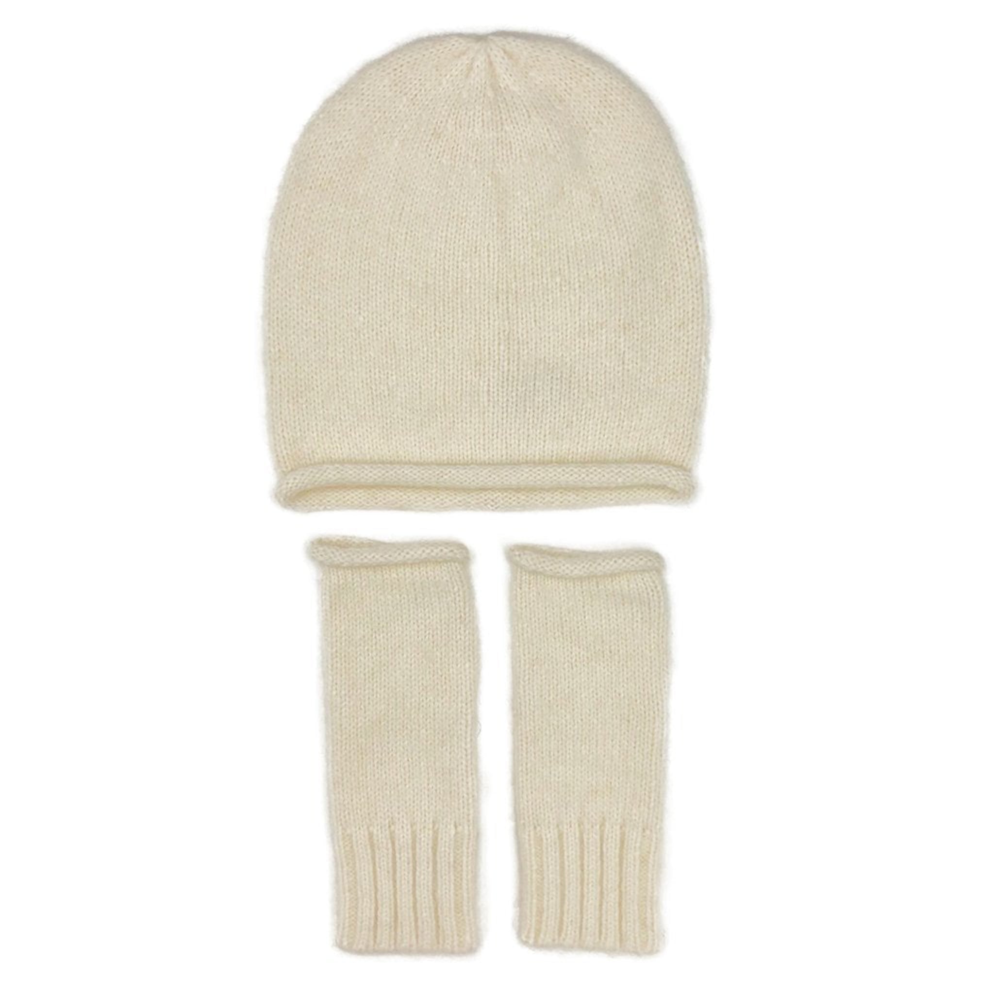 White knit beanie and fingerless gloves set on a white background