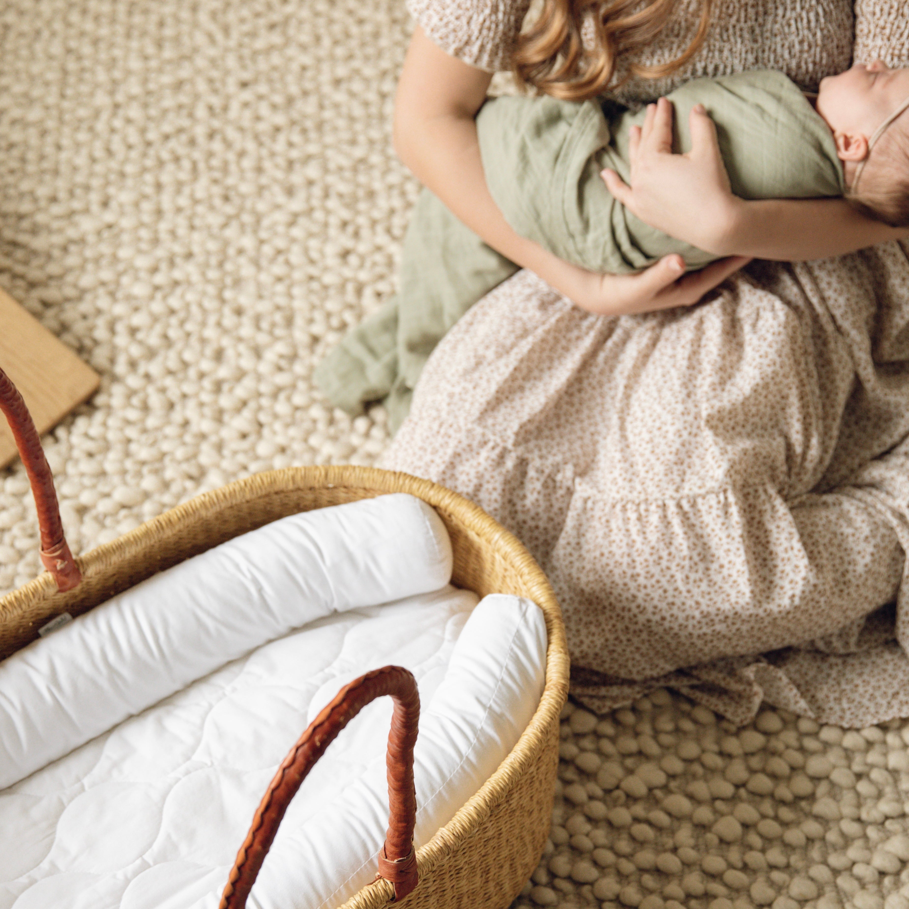 Plum+Sparrow Nest Lounger in white cotton, ideal for nursery decor and baby diaper changes