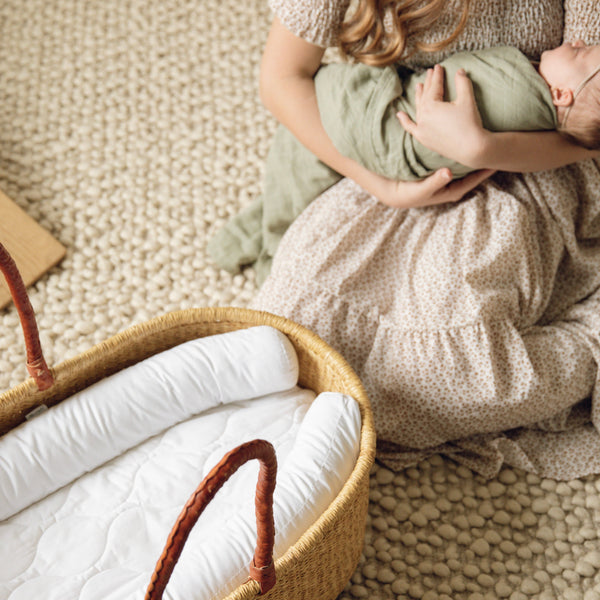 Plum+Sparrow Nest Lounger in white cotton, ideal for nursery decor and baby diaper changes