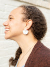 White clay stud earrings styled on model, nickel-free fair trade jewellery by Fair Anita