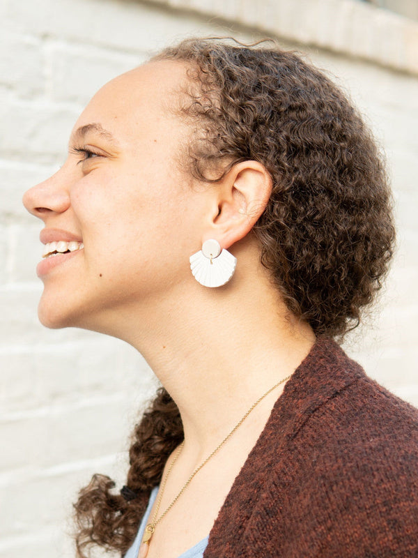 White clay stud earrings styled on model, nickel-free fair trade jewellery by Fair Anita