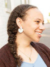 Pair of white seashell clay earrings flat lay — ethically made by women artisans in India