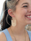 White woven raffia hoop earrings by Fair Anita – nickel-free and ethically handmade