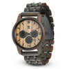 Wild black sandalwood and zebrawood chronograph wooden watch with polished stainless steel accents on a neutral background