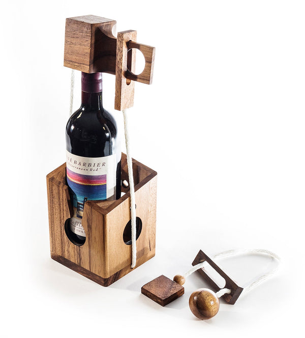 Wooden wine bottle holder with a bottle of wine inside, on a white background
