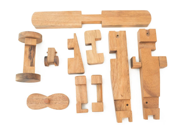 Set of wooden toy parts on a white background