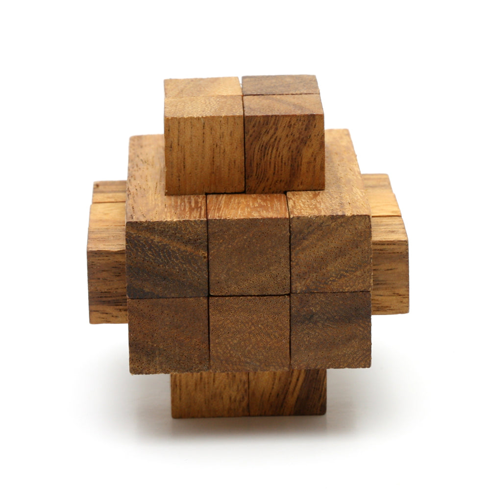 Wooden interlocking burr puzzle by Kubiya Games, the Notch assembled on a flat surface