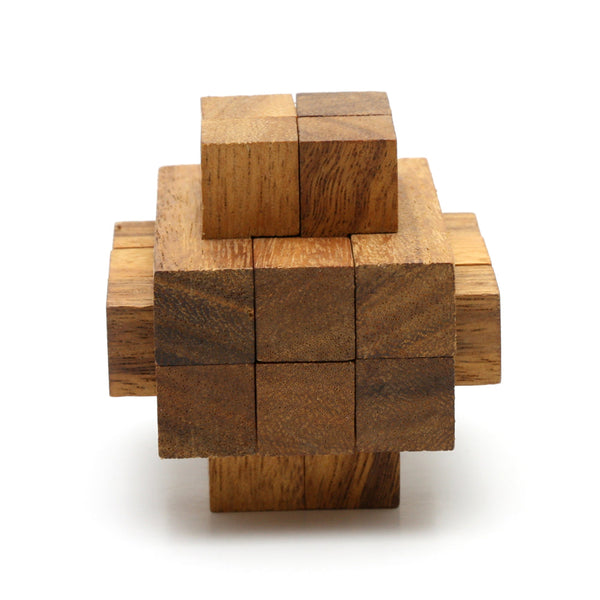 Wooden interlocking burr puzzle by Kubiya Games, the Notch assembled on a flat surface