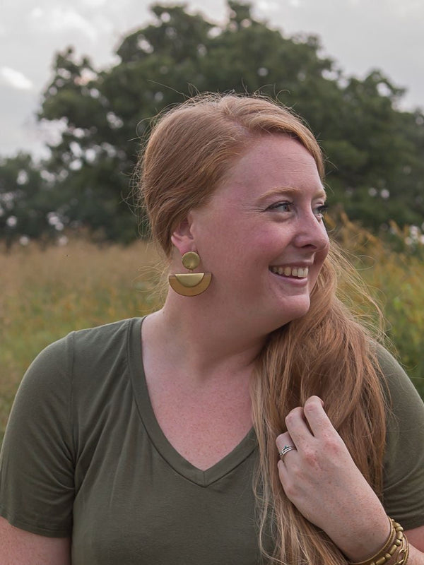 Fair Anita Chord Wood Stud Earrings in brass worn as a lifestyle jewellery shot