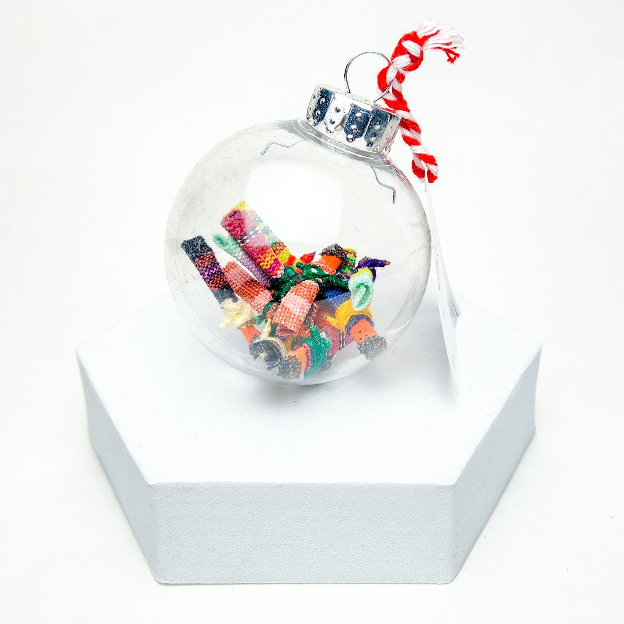 Find peace and tranquility with our Worry Globe Ornament. This enchanting piece features 12 mini worry dolls, inspired by ancient Guatemalan tradition. A perfect gift for any occasion, it's a beautiful and practical way to relieve stress and find serenity.