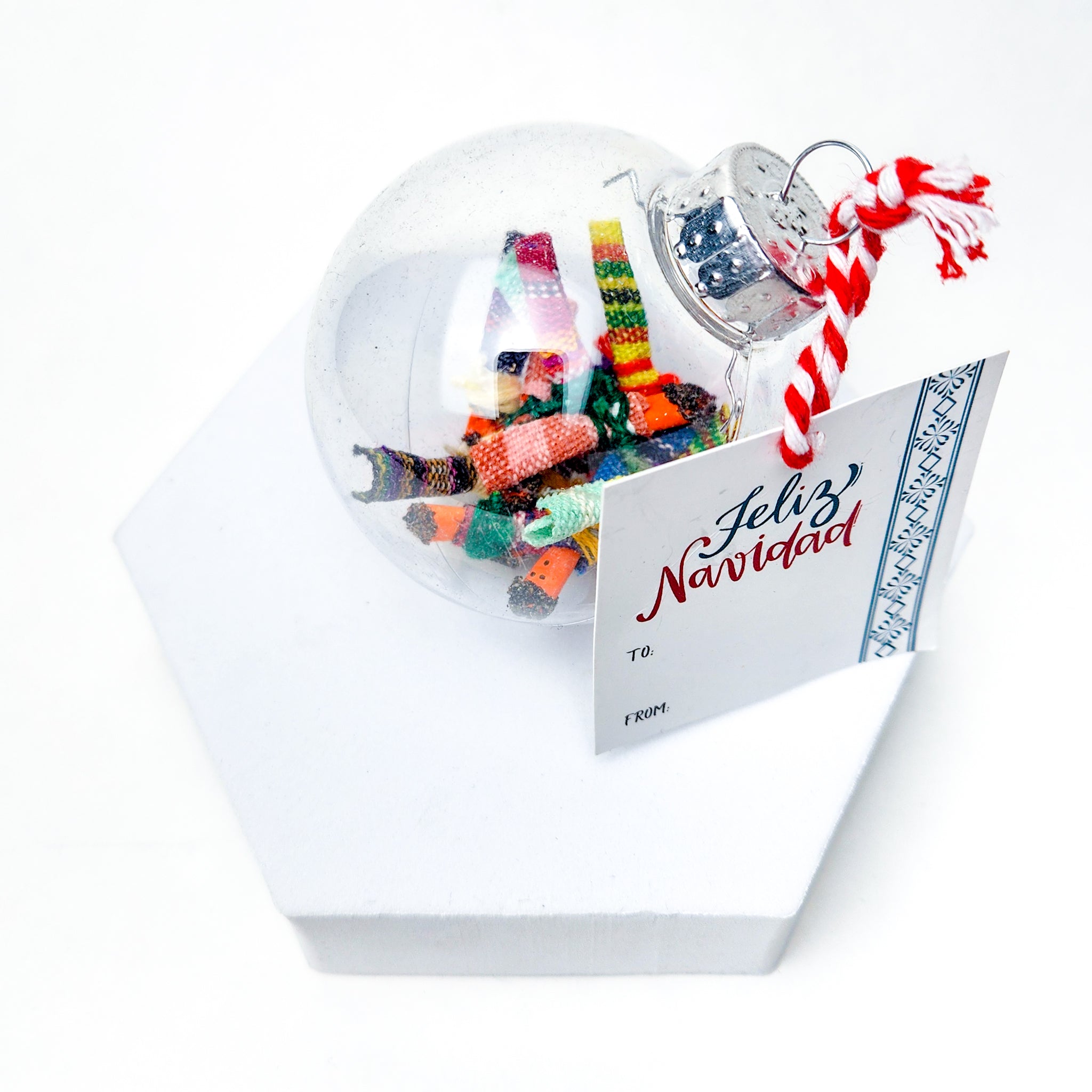 Find peace and tranquility with our Worry Globe Ornament. This enchanting piece features 12 mini worry dolls, inspired by ancient Guatemalan tradition. A perfect gift for any occasion, it's a beautiful and practical way to relieve stress and find serenity.