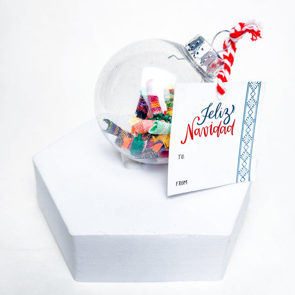 Find peace and tranquility with our Worry Globe Ornament. This enchanting piece features 12 mini worry dolls, inspired by ancient Guatemalan tradition. A perfect gift for any occasion, it's a beautiful and practical way to relieve stress and find serenity.