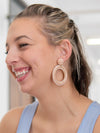 Woven pink statement hoop earrings by Fair Anita – close-up detail of beads and cord