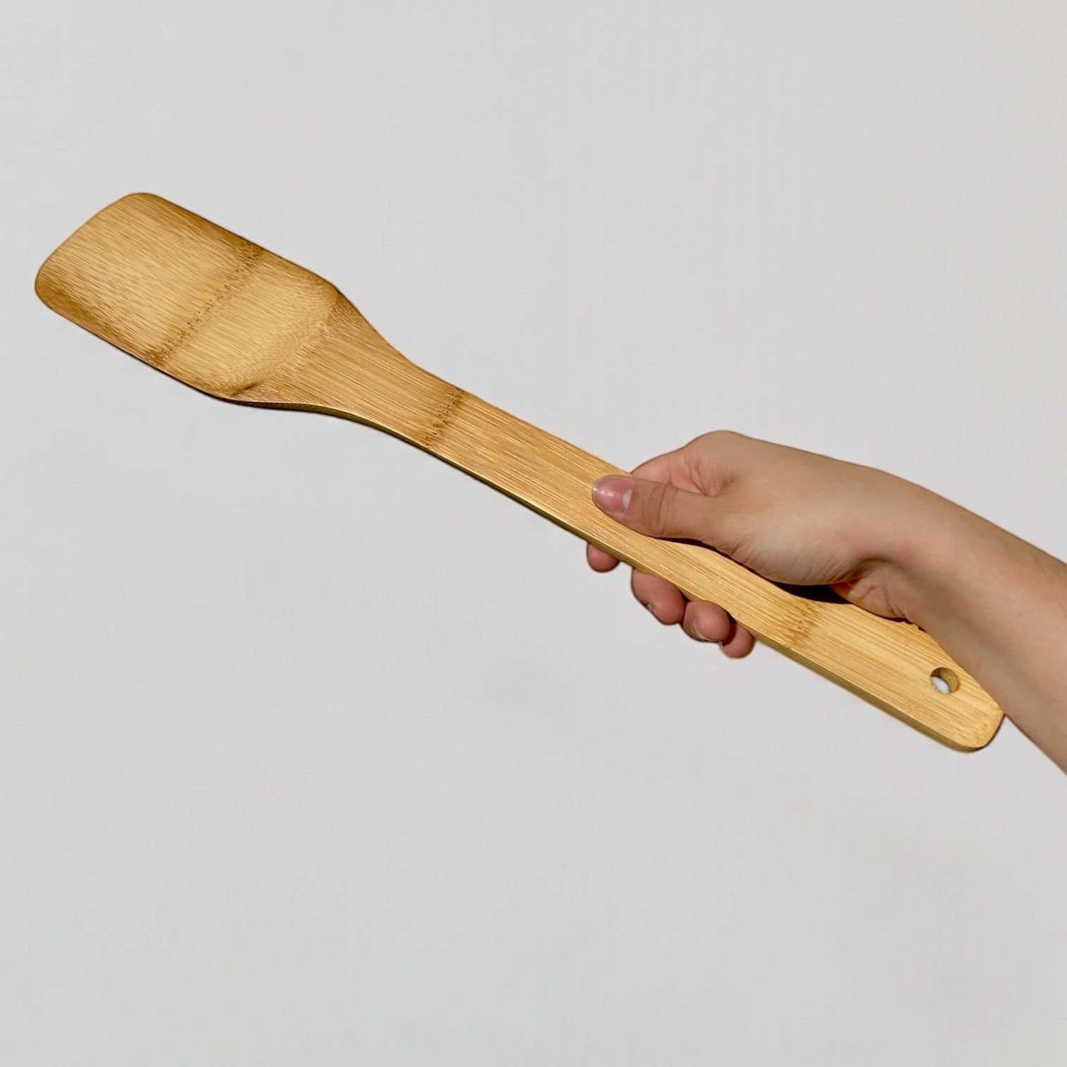 Bamboo XL Barbeque Grilling Spatula shown alongside outdoor grilling setup